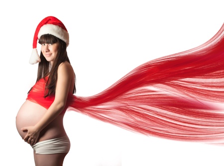 Pregnant woman with red fabric  isolatedの写真素材