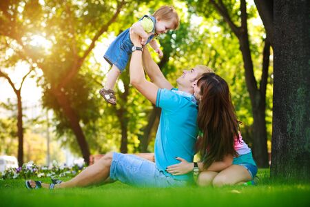 happy family on vacation in the summer parkの写真素材