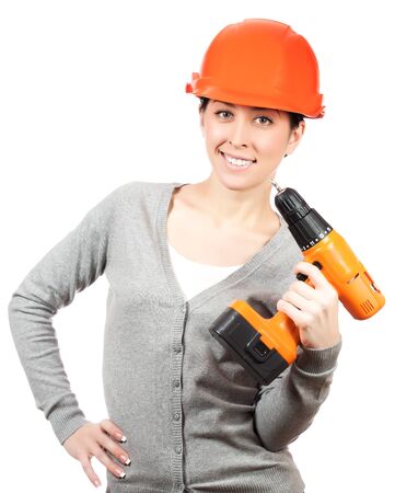 woman with orange hard hat and screwdriver  isolatedの写真素材