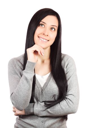 Beautiful casual young woman standing against whiteの写真素材