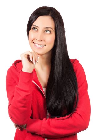 Beautiful casual young sportswoman standing against whiteの写真素材