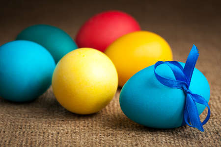 colored Easter eggs on the burlapの写真素材