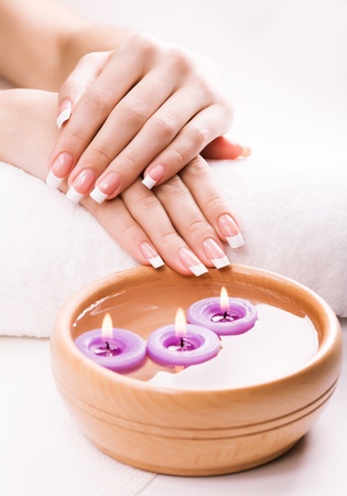 french manicure  with aromatic candles and towelの写真素材