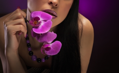 Beautiful young woman with pink make-upの写真素材