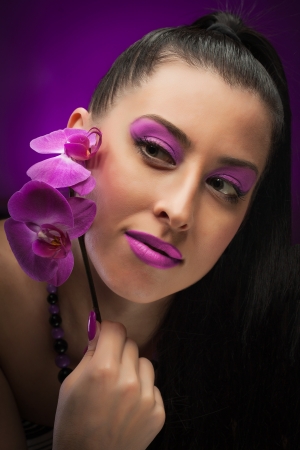 Beautiful young woman with pink make-upの写真素材