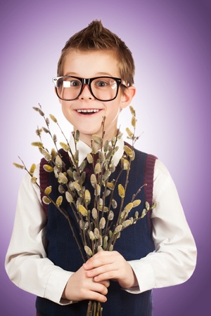 bespectacled boy in a hurry for a date with a bunch of willowの写真素材