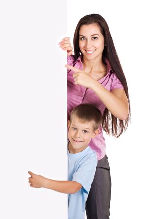Mom and son are points at a white sheetの写真素材