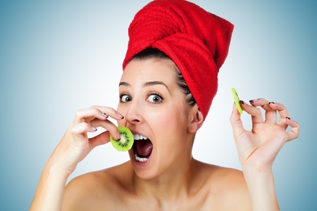 attractive woman with kiwi fruit mask as a foodの写真素材