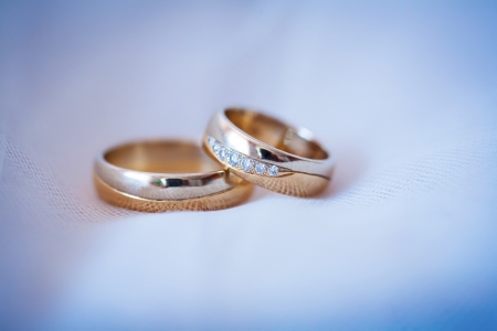beautiful golden rings on the blue wedding dressの写真素材