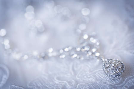 jewelry on a white wedding dressの写真素材
