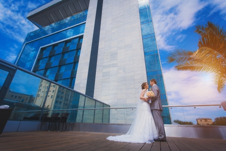 bride and groom near the buildingの写真素材