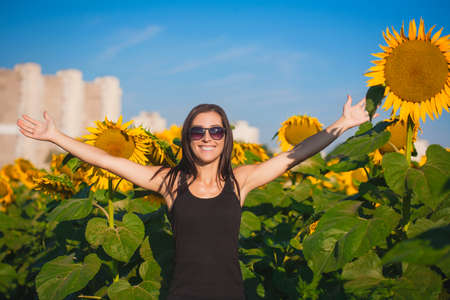 pretty woman in a sunflower's fieldの写真素材