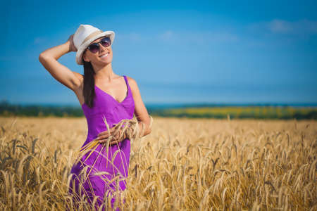 pretty girl in a wheat fieldの写真素材