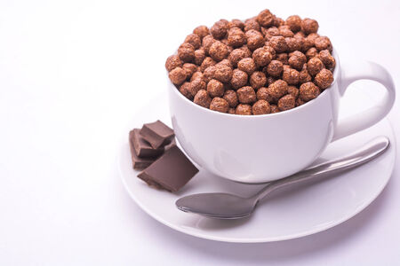 bowl with chocolate balls isolatedの写真素材