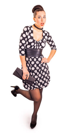 beautiful lady in a polka dot dress on a white backgroundの写真素材
