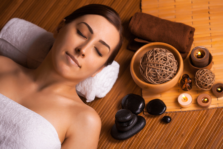 beautiful brunette in a massage parlorの写真素材