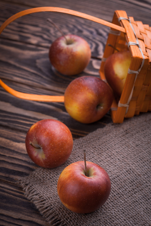 fresh red apples on wooden table, selective focusの写真素材
