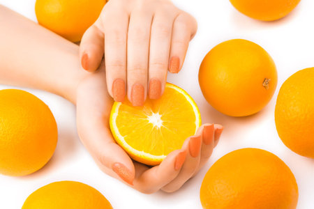 beautiful orange manicure with fresh oranges