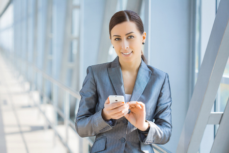 Portrait of pretty businesswoman on the modern backgroundの写真素材