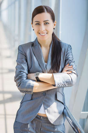 Portrait of pretty businesswoman on the modern backgroundの写真素材