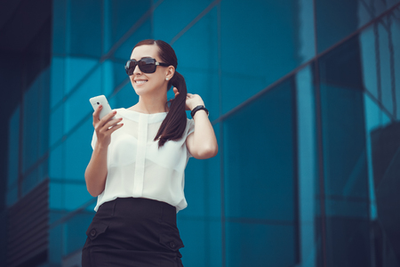 businessman or entrepreneur talking on cellphone. City businesswoman working.の写真素材