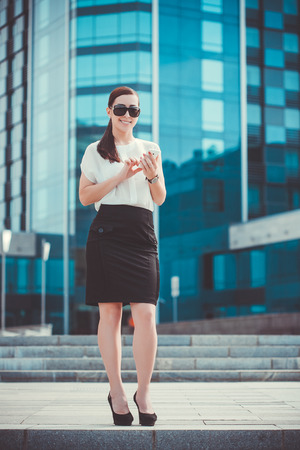 businessman or entrepreneur talking on cellphone. City businesswoman working.の写真素材