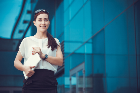 Successful businessman working at laptop. City businesswoman working.の写真素材