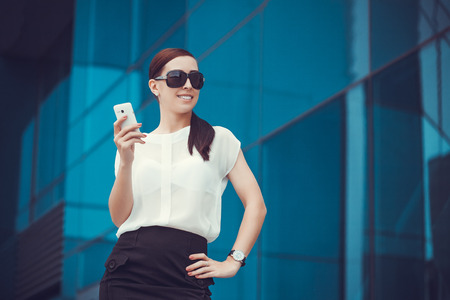 businessman or entrepreneur talking on cellphone. City businesswoman working.の写真素材