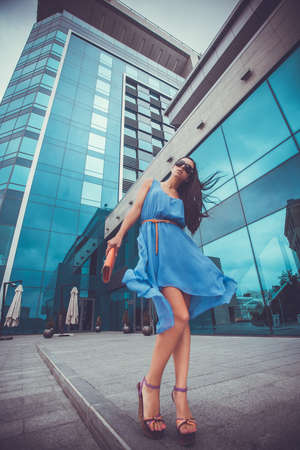 pretty woman is walking in the cityの写真素材