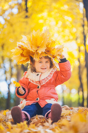 baby in the autumn parkの写真素材