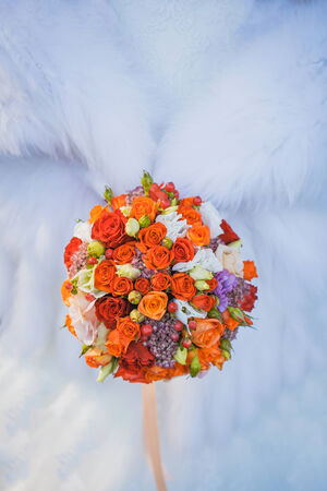 A bridal bouquet on the weddind dressの写真素材