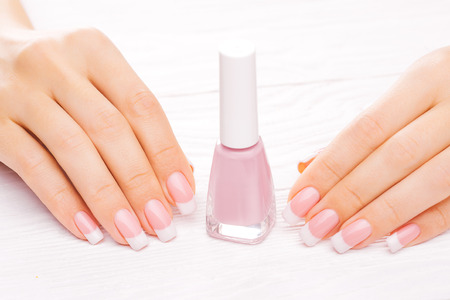 beautiful french manicure on whiteの写真素材