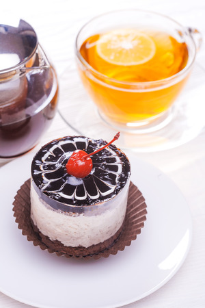 Delicious of Green tea mousse cake on wooden tableの写真素材