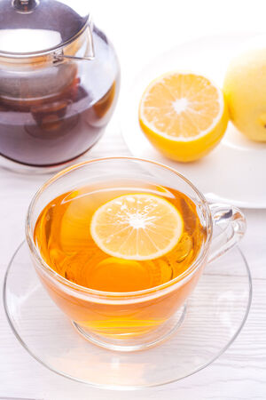 Cup of tea with lemon on table close-upの写真素材