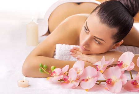 Pretty young women relaxing in the spa salonの写真素材