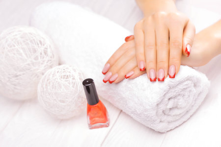 french manicure with red poppy flowerの写真素材