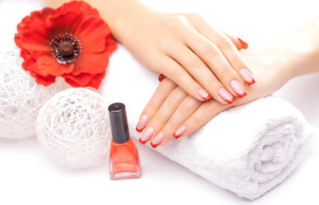 french manicure with red poppy flowerの写真素材