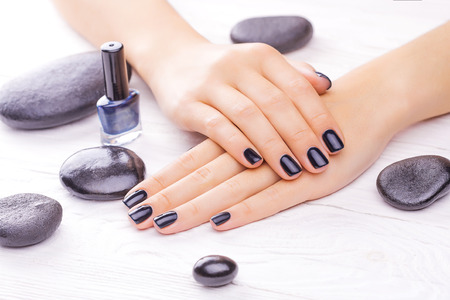 black manicure with black stonesの写真素材