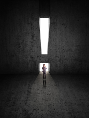 businesswoman against black wall with exclamation mark holeの写真素材