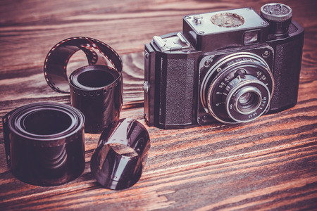 Old camera on wooden tableの写真素材