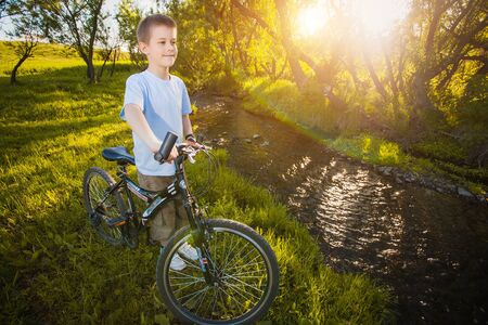 happy funny kid on bicycle. Active Leisureの写真素材