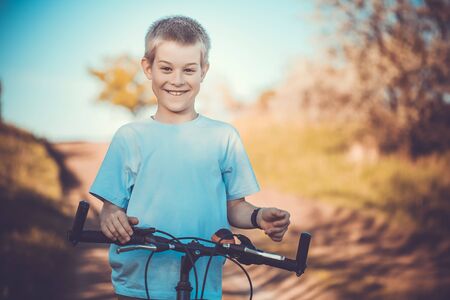 happy funny kid on bicycle. Active Leisureの写真素材