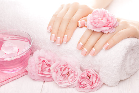 french manicure with rose flowers. spaの写真素材