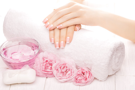 french manicure with rose flowers. spaの写真素材