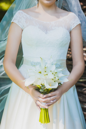 kala wedding bouquet in bride's handsの写真素材
