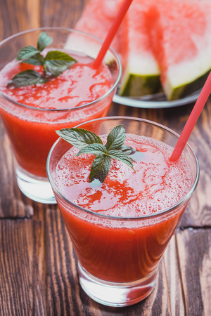 Watermelon smoothie on a wooden table. Selective focusの写真素材