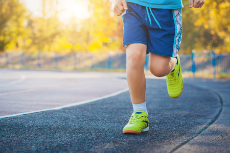 Runner's Feet Running on Stadium. Closeup - outdoor shotの写真素材