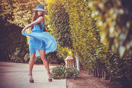 Beautiful young woman in the summer gardenの写真素材
