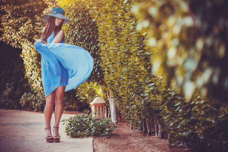 Beautiful young woman in the summer gardenの写真素材