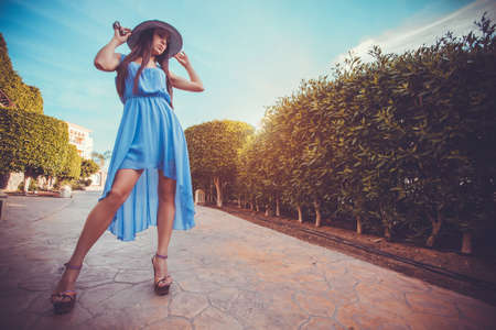 Beautiful young woman in the summer gardenの写真素材